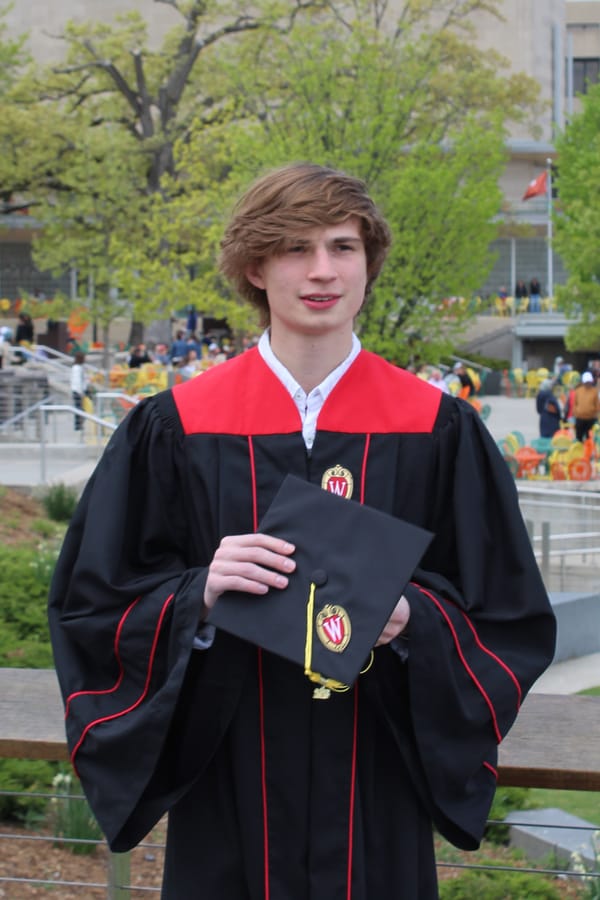 Me at Memorial Terrace in graduation regalia.
